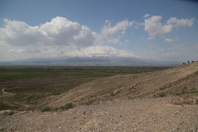 Scenic view of agricultural field against sky