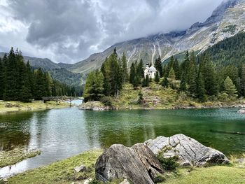 Scenic view of lake and mountains against sky