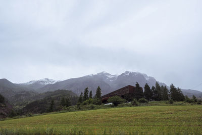 Scenic view of landscape and mountains against sky