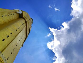 Low angle view of building against clouds