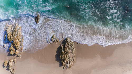 High angle view of rocks on beach