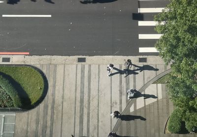 High angle view of people walking on road