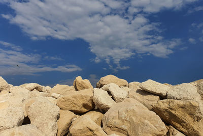 Low angle view of rocks against sky