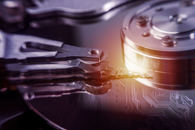 Close-up of hard drive against digital background