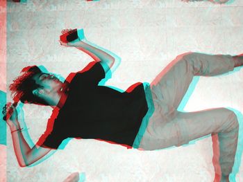 High angle view of man sleeping on floor
