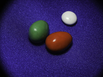 Close-up of multi colored balls on table