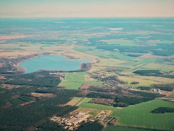 Aerial view of agricultural landscape against sky