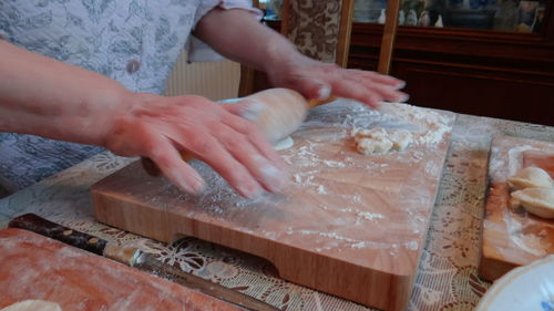 Hands of senior woman preparing food