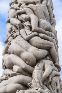 Low angle view of sculptures at gustav vigeland sculpture park