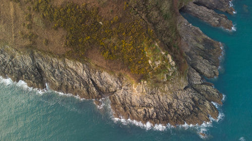 High angle view of rocks in sea