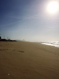 Scenic view of beach against sky during sunset