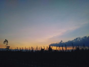 Silhouette landscape against sky during sunset