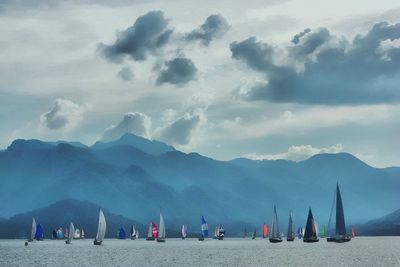 Scenic view of mountains against cloudy sky