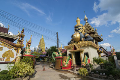 Statue of temple against building