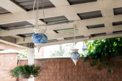 Low angle view of decoration hanging on wall