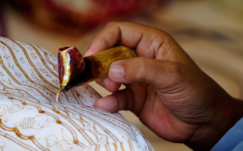 Close-up of hand holding bread