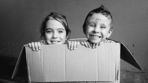 Portrait of smiling sister and brother