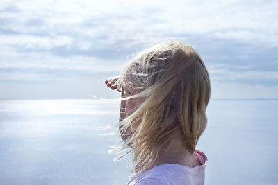 Girl looking at sea, osterlen, skane, sweden