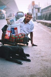 Full length of man sitting at market