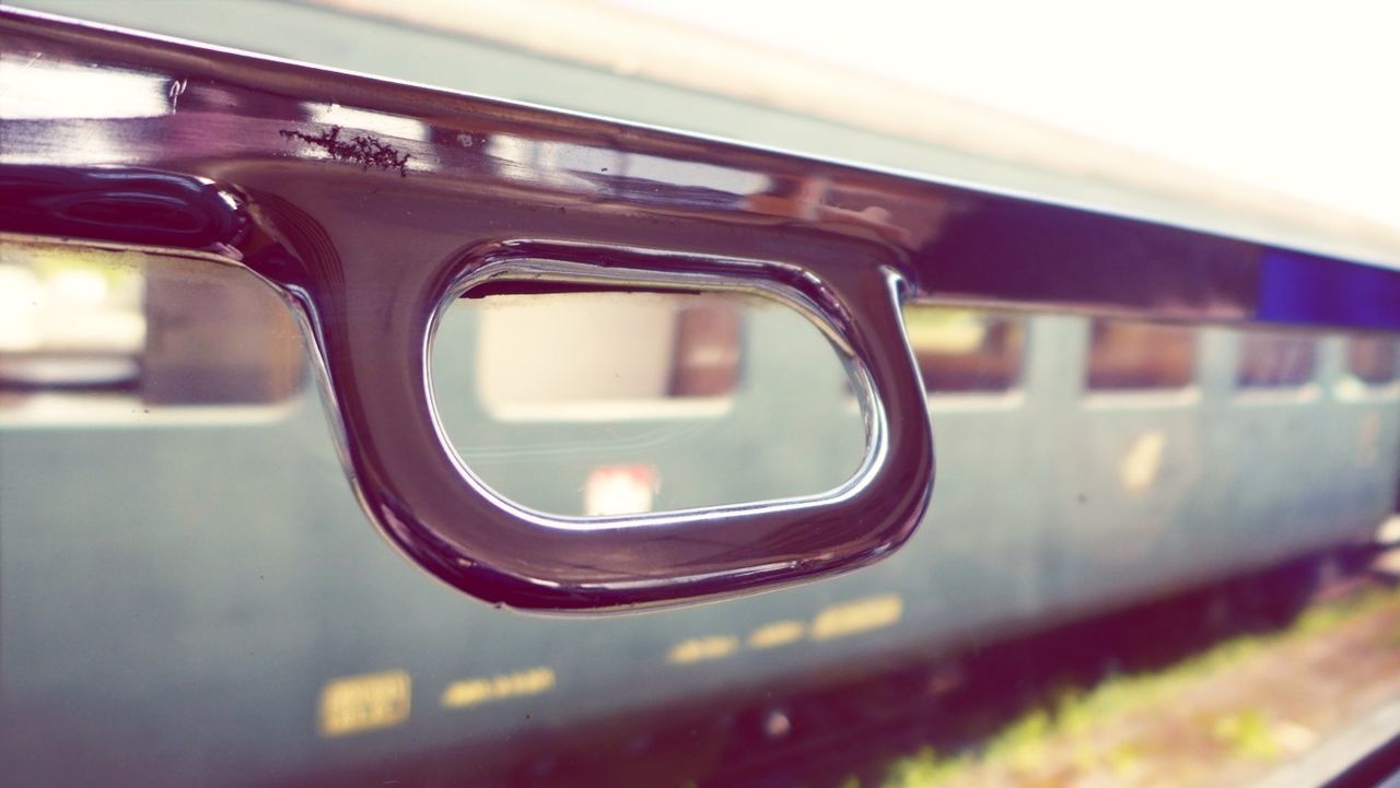 transportation, mode of transport, land vehicle, car, indoors, vehicle interior, public transportation, train - vehicle, travel, close-up, reflection, passenger train, train, focus on foreground, rail transportation, railroad station platform, railroad track, glass - material, window, side-view mirror