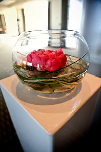Close-up of roses in vase on table