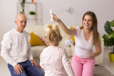 Portrait of happy friends enjoying at home