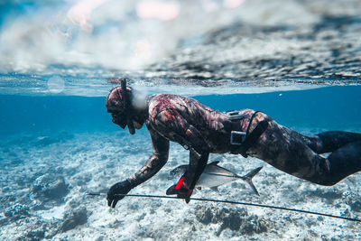 Man fishing in sea