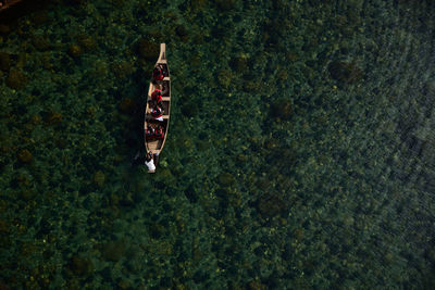 Directly above shot of people on boat sailing in sea