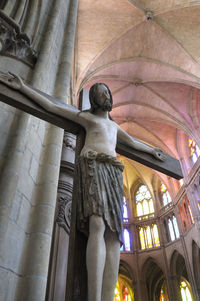 Low angle view of statue against building