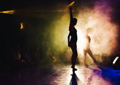 Rear view of man standing on stage