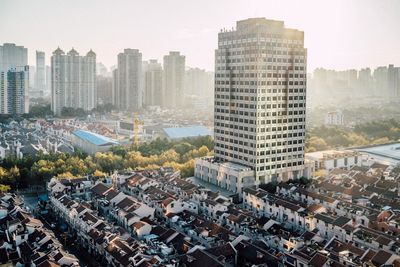 High angle view of buildings in city against sky