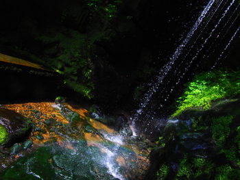 Scenic view of waterfall at night