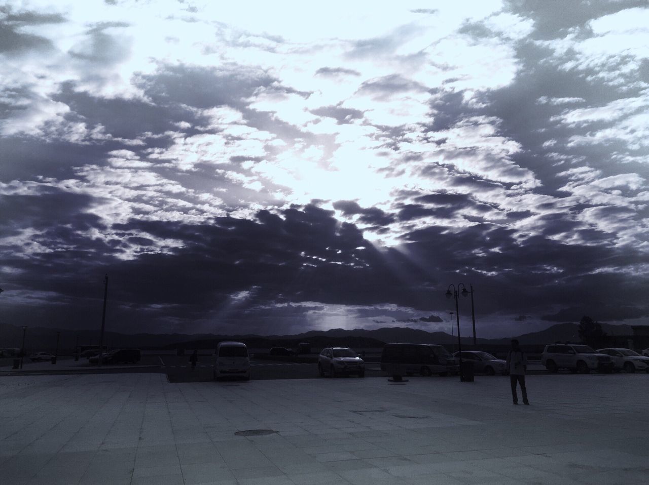 sky, cloud - sky, weather, cloudy, street light, water, transportation, nature, street, tranquility, scenics, dusk, road, beauty in nature, night, cloud, outdoors, storm cloud, silhouette, overcast