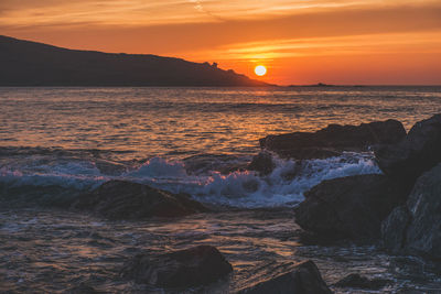 Scenic view of sea during sunset