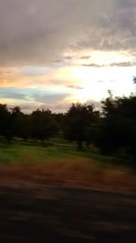Scenic view of landscape against sky at sunset