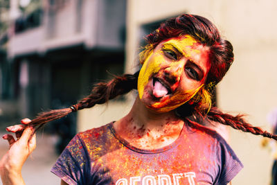 Close-up portrait of woman covered with powder paint