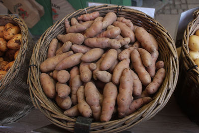 High angle view of eggs in basket for sale at market stall