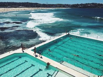 People in infinity pool at bondi beach