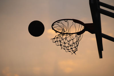 Low angle view of basketball hoop against sky