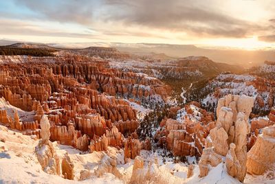 Snow covered bryce canyon at sunrise