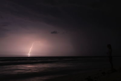 Scenic view of sea against sky at night