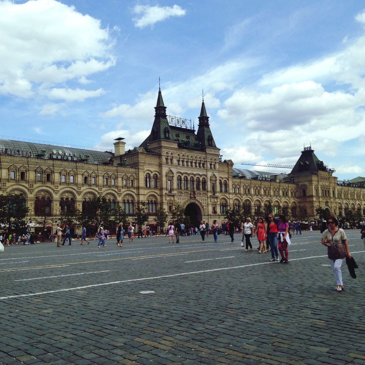 architecture, large group of people, building exterior, built structure, sky, person, men, history, famous place, tourism, travel destinations, tourist, lifestyles, travel, cloud - sky, leisure activity, international landmark, walking, mixed age range