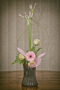 Close-up of flower vase on table at home