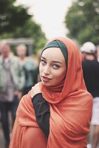 Portrait of smiling young woman wearing hijab