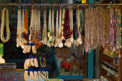Clothes hanging for sale at market stall