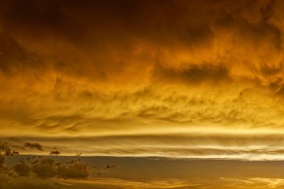 Scenic view of dramatic sky during sunset