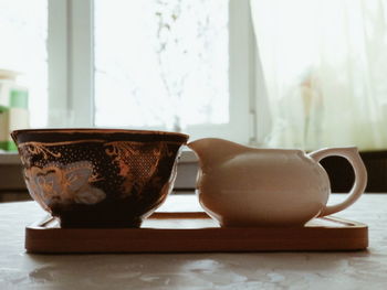 Close-up of crockery on table