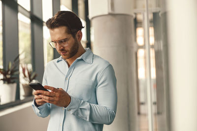 Young man using mobile phone