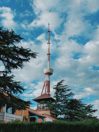 Low angle view of communications tower against sky