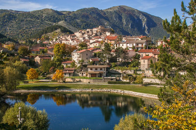 Scenic view of lake by buildings in town